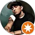  Eminem wearing a baseball cap and black t-shirt